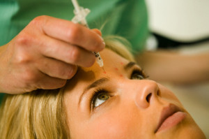 Woman receiving facial injections